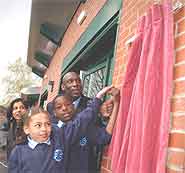 Uriah Rennie, with Nathan Modest and Armani Williams, two of our young, up-and-coming sports talents unveiling the plaque.
