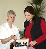 Amanda Wells shows Gaby the various types of oils she uses.